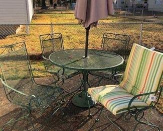 patio set, comes with four bouncy chairs, four pads, table and umbrella. Very nice