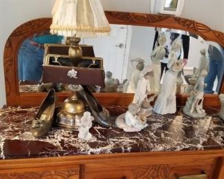 Top of Art Deco side board and mirror of chocolate and white marble