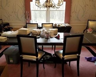 Black lacquer Art Deco style dining table with glass insert, Black lacquer chairs, silver pleather fabric. Matching buffet