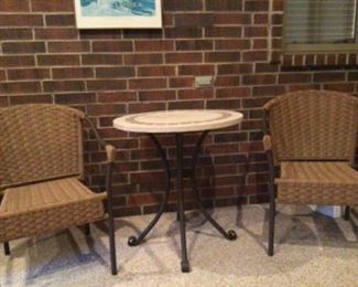 Outdoor chairs and tile top table. Always inside an enclosed porch.