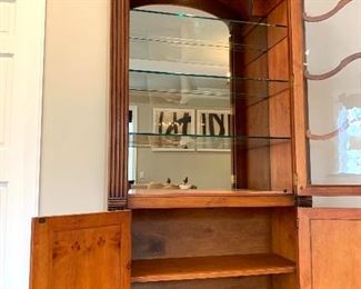 $800 Exquisite Illuminated Curio Cabinet with ornate wood work. Features seeded glass doors to add to the richness of this already stunning piece. Two Doors below allow for additional shelving storage 42”17”x90”