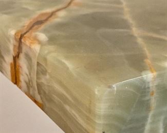 Close up view of the green marble pedestal. 