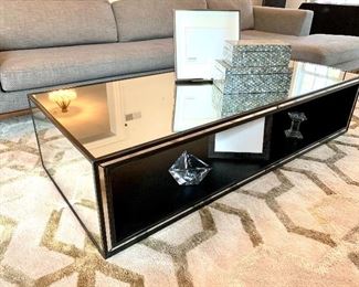 $600 Restoration Hardware Strand Mirrored Coffee Table. The simplicity and meticulous of this table is downplayed by its glamour and design! 48"x30"16" Retails for $1100 Buy it here for $600!!