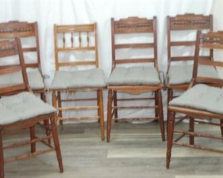Set of 6 wooden chairs with woven cane seats and cushions
