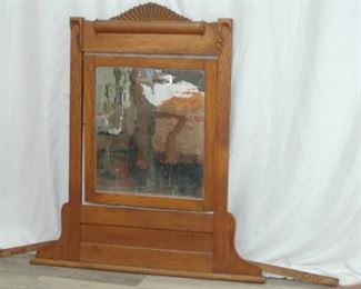 Wooden framed mirror, likely from the top of a dresser or vanity table
