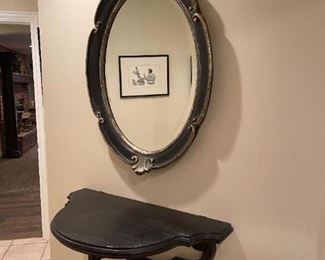 LOT 6631 Oval mirror with black and gold accent mirror 3' width x 5' height $550 
