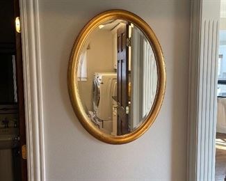 LOT 6689 Gold oval beveled mirror 2' width x 2'8" height $100 
