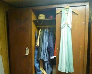 Handmade wardrobe closet on wheels shown with men's  work clothing (some jumpsuits).