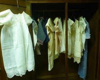 Wardrobe cabinet shown with some darling antique handsewn children's clothing for little boys and girls!