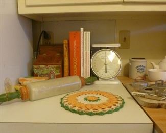 Vintage kitchen items such as scale, antique rolling pin, boxes of recipes and books and more.