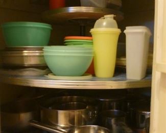 Tupperware and several stainless pots and pans.