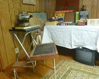 Antique toddlers school desk and slide project on stand (screen is also available).