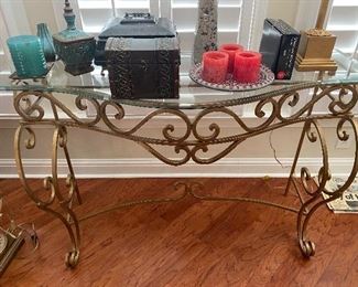 Console table with iron base and glass top