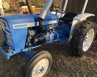 #0)  $3000 - Ford 1600  Diesel Farm Tractor.  Model A1012T Serial #U111288.  2WD, 23 HP, 540 Rear PTO 3Pt Hitch, Sold with a 60 inch blade with Hydrolic Lift.  Sold with a plow attachment.  Six forward gears, 2 reverse gears, Rear auxiliary hydraulic.  Runs well.