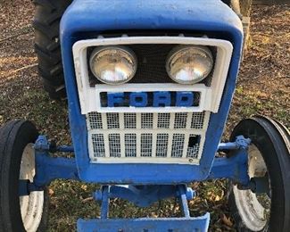 #0)  $3000 - Ford 1600  Diesel Farm Tractor.  Model A1012T Serial #U111288.  2WD, 23 HP, 540 Rear PTO 3Pt Hitch, Sold with a 60 inch blade with Hydrolic Lift.  Sold with a plow attachment.  Six forward gears, 2 reverse gears, Rear auxiliary hydraulic.  Runs well.