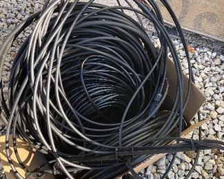 #13) $15 - Rolled drip-irrigation system tubing, several hundred feet, various sizes