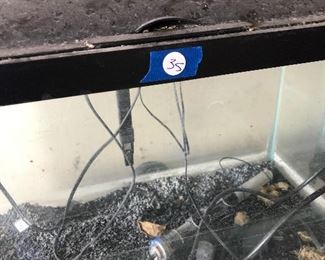 #35) $150 All - Aquarium equipment including four aquariums, two 8-gallon and two 20-gallon aquariums with stands, books, and assorted equipment