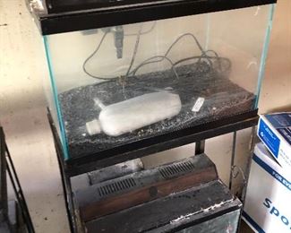 #35) $150 All - Aquarium equipment including four aquariums, two 8-gallon and two 20-gallon aquariums with stands, books, and assorted equipment