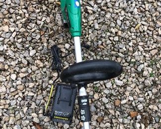 #7) $20 - Weed Eater Brand Battery Powered Yard Trimmer  with Lithium Battery Charger.