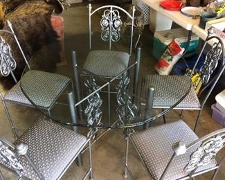 #60) $325 - Iron Table with Glass Top and 5 Iron/Fabric Chairs.  48 inch table.  