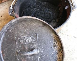 #75) $15 - Cast iron dutch oven with lid.