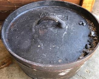 #75) $15 - Cast iron dutch oven with lid.