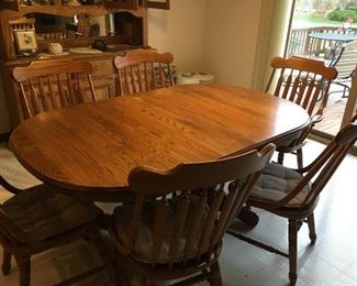 . . . this is a beautiful dining room table and chairs with matching hutch