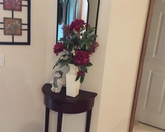 . . . . a nice wall table with accent vase and mirror