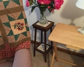 . . . . a nice plant stand, snack table, throw quilt