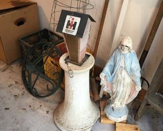 . . . . a madonna and bird house