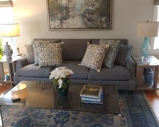 The couch and cocktail table are sold. The rest in the picture is available.