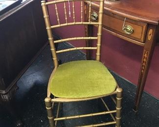 Love this little gold bamboo chair.