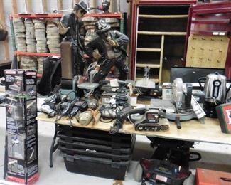 In the backround cut up 10 to 14 inch slices of wood ready for fire or for center piece in wedding  Chop saws Budwiser neon Chopsaw craftsman table 