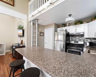 Stainless steel sink, all kitchen cabinets (upper & lower); faux-granite Formica counter tops