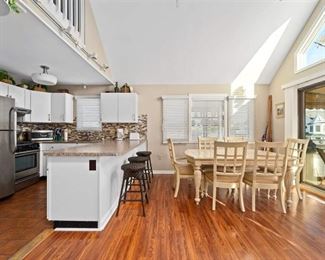 Gorgeous Pergo floating floor. Kitchen cabinets (uppers & lowers), faux granite counter tops 