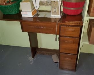 vintage sewing machine in cabinet