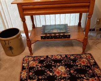 1800s Early American table with drawer; #4 Bee Sting crock (has hairline crack); needlepoint rug