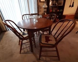 Antique table and four spindle-back chairs