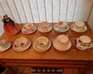 Cups and saucers sets; Royal Doulton figurine