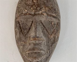 Item 150a:  (5) Wood carved faces:  This one is $65                                                            Largest - 6"                                                                                                               Smallest - 4"