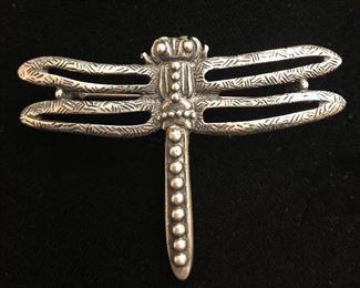 Item 99:  New pro dragonfly… Not silver but just vintage. $20