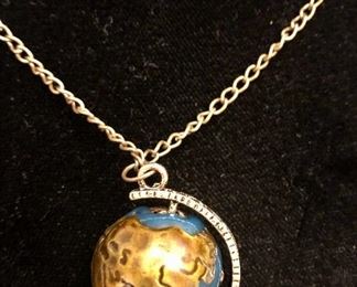 Item 113:  Costume jewelry necklace of the world with a pair of binoculars so you can see the world clearly: $28