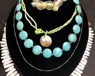Item 114:  (4) Necklaces and one bracelet:  $55