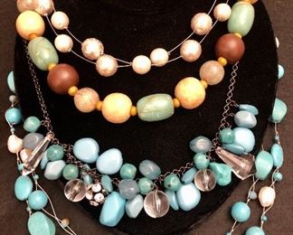 Item 115:  (4) Necklaces with two blue hued ones:  $55