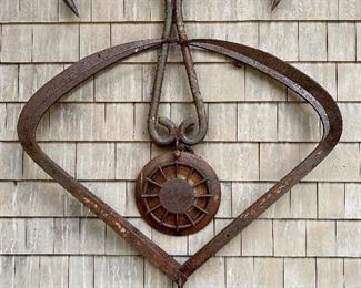 Item 303:  Farm Equipment Sculpture purchased in New Hampshire - 39”w  x 50”h and sticks out 6 1/2”: $150
