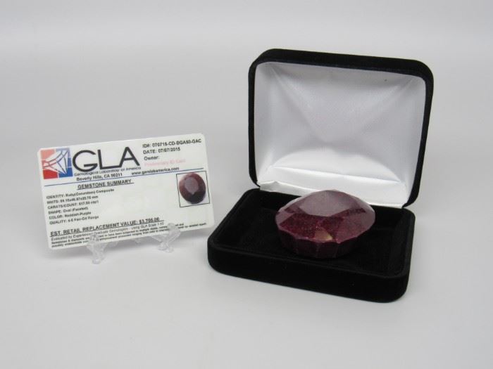 Stone: Ruby
Type: Gemstone
Weight (ct): 617.50 cts
Size: 59.15mm X 46.87mm X 25.75mm
Appraisal *Appraisal*
Located in: Chattanooga, TN **Sold As-Is Where Is**
Appraisal Value - $3,705.00
Shape - Oval (Faceted)
Color - Reddish/ Purple

66-16220010
