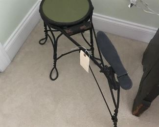 Vintage wrought iron shoe shine bench