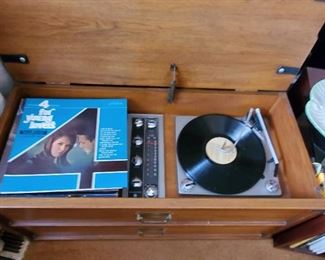 COOL MCM AM/FM....PHOHOGRAPH PLAYER WITH BUILT IN SPEAKERS. THE TOP CUSHION CAN BE A SEAT....BUT IS REMOVABLE TOO. THIS PIECE WORKS AND HAS GREAT SOUND QUALITY
