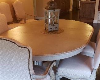 Dining room oval table with 6 chairs. Distressed, upholstered beautiful fabric chairs