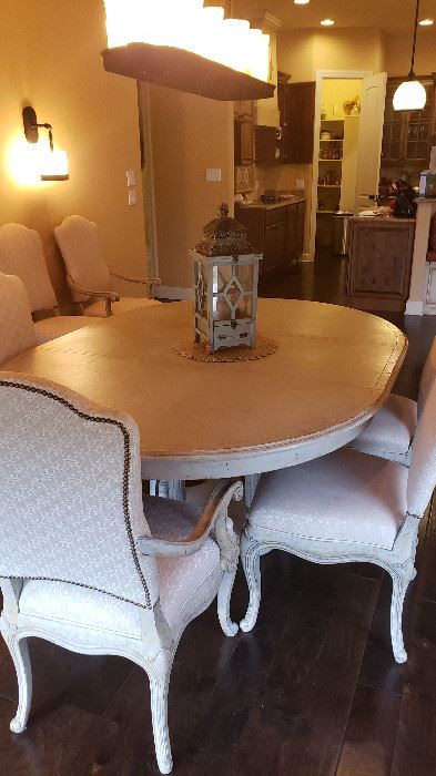 Dining room oval table with 6 chairs. Distressed, upholstered beautiful fabric chairs